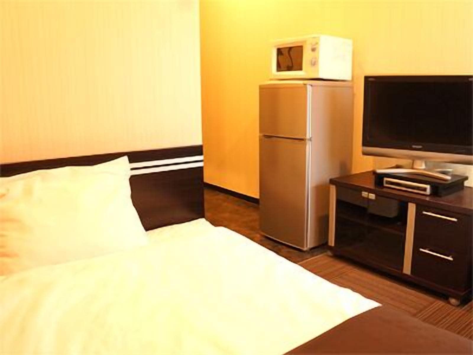 Hotel Livemax Budget Esaka Suita Bagian luar foto