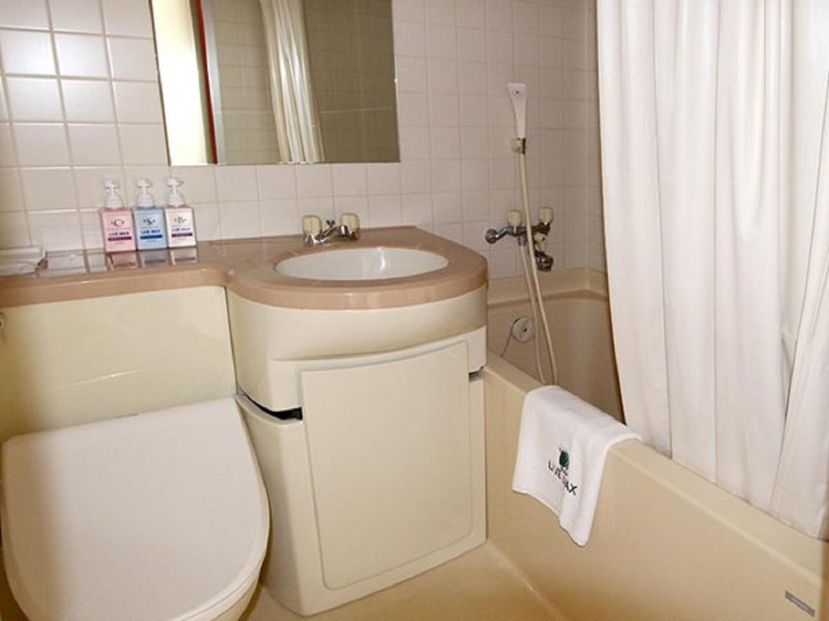 Hotel Livemax Budget Esaka Suita Bagian luar foto
