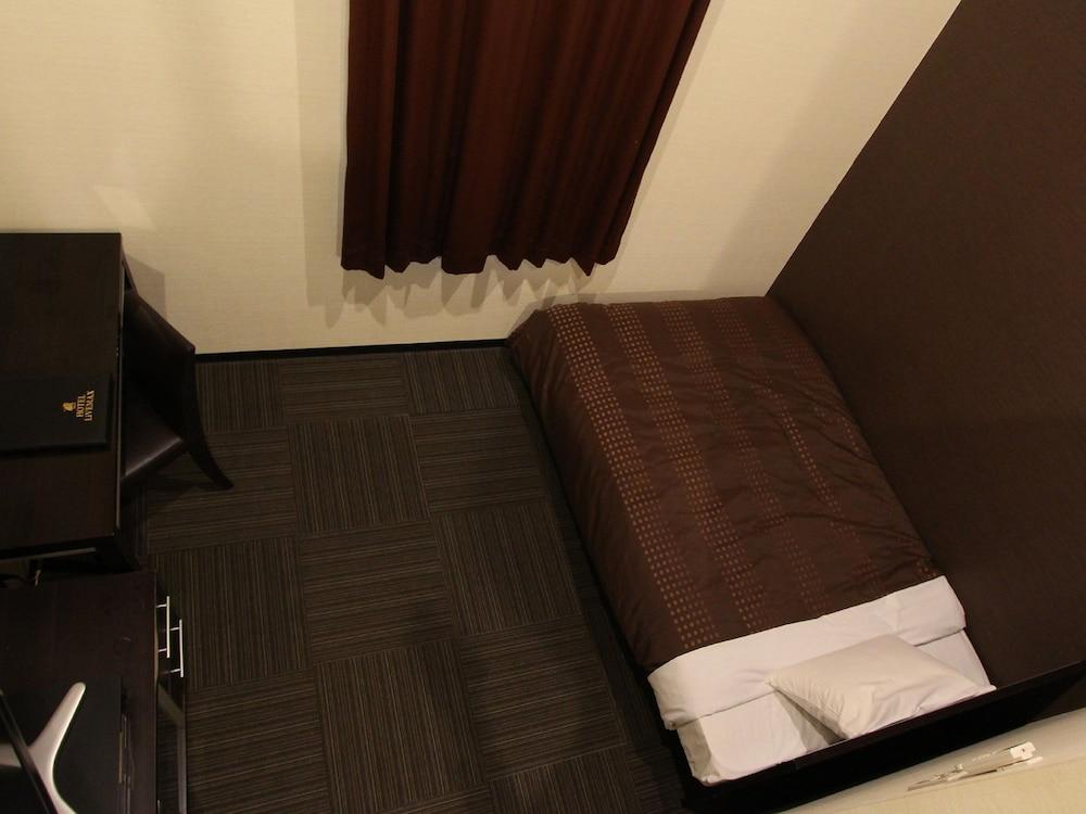 Hotel Livemax Budget Esaka Suita Bagian luar foto
